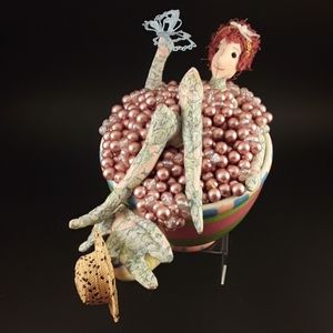 Garden fairy in a tea cup bathtub